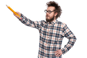 Image showing Crazy bearded man with big pencil