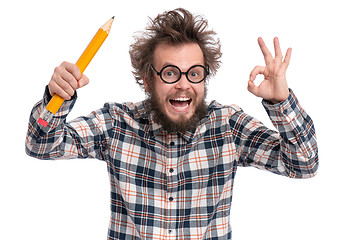 Image showing Crazy bearded man with big pencil