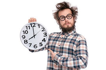 Image showing Crazy bearded man with big clock