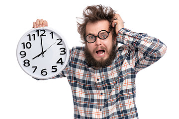 Image showing Crazy bearded man with big clock