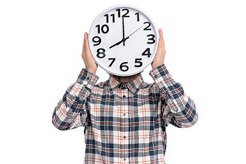 Image showing Crazy bearded man with big clock