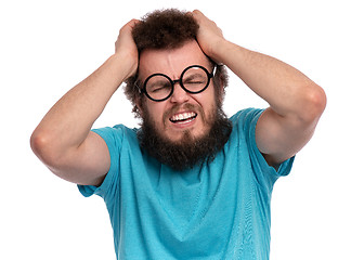 Image showing Crazy bearded man has headache