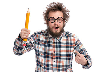 Image showing Crazy bearded man with big pencil