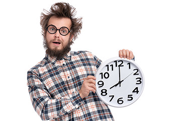 Image showing Crazy bearded man with big clock