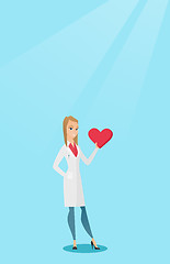 Image showing Doctor cardiologist holding heart.