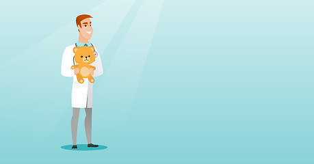 Image showing Pediatrician doctor holding teddy bear.