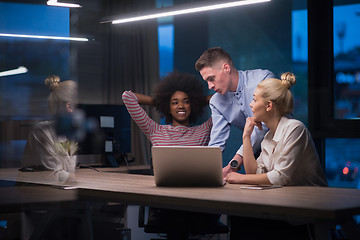 Image showing Multiethnic startup business team in night office