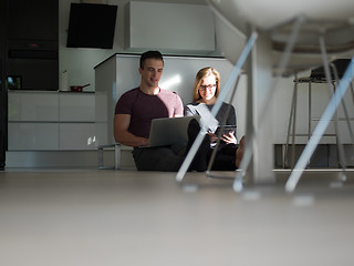 Image showing couple using tablet and laptop computers