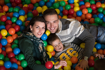 Image showing young parents with kids in a children\'s playroom