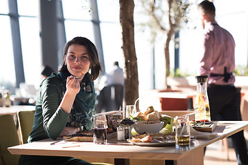 Image showing young woman at a restaurant