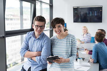 Image showing Two Business People Working With Tablet in office