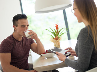 Image showing couple enjoying morning coffee and strawberries