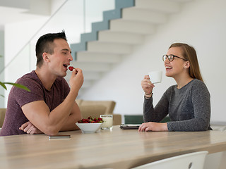 Image showing couple enjoying morning coffee and strawberries