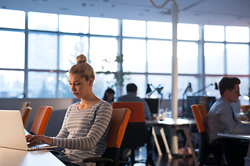 Image showing businesswoman using a laptop in startup office