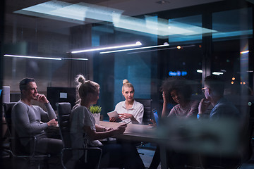 Image showing Multiethnic startup business team in night office