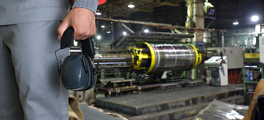 Image showing Worker with protective headphone