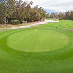 Image showing Golf course hole green and sand traps.