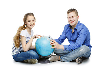 Image showing Teen boy and girl with earth globe