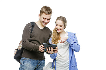 Image showing Teen boy and girl standing with mobile phones