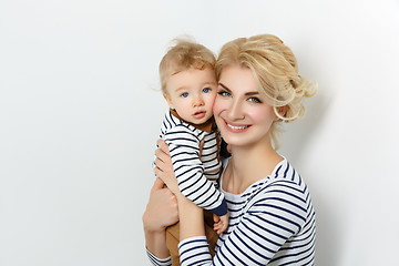 Image showing Beautiful young woman with toddler