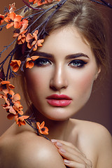 Image showing Beautiful girl with sakura branch