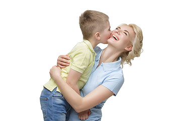 Image showing Young mother hugging son