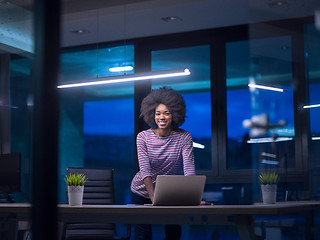 Image showing black businesswoman using a laptop in startup office