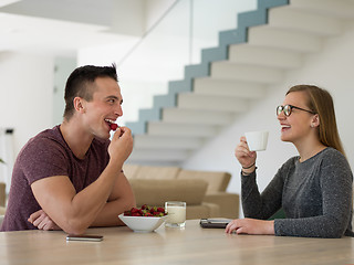 Image showing couple enjoying morning coffee and strawberries