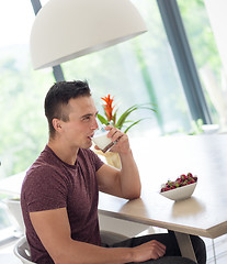 Image showing couple enjoying morning coffee and strawberries