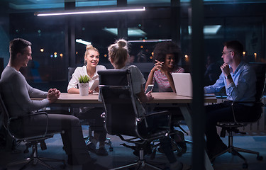 Image showing Multiethnic startup business team in night office