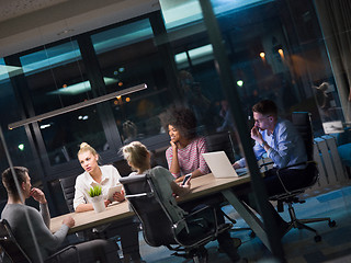 Image showing Multiethnic startup business team in night office