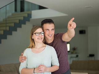 Image showing couple hugging in their new home