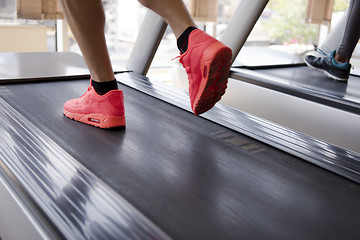 Image showing sportsman exercise jogging on treadmill