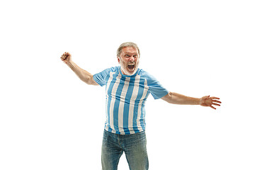 Image showing The Argentinean soccer fan celebrating on white background