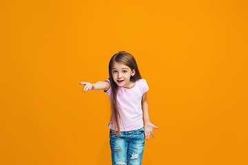 Image showing Beautiful female half-length portrait on studio backgroud. The young emotional teen girl