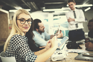 Image showing blonde business woman learning about drone technology