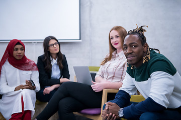 Image showing Multiethnic startup business team having meeting