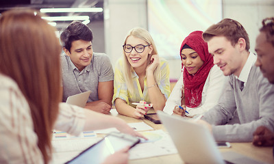 Image showing Multiethnic startup business team having meeting