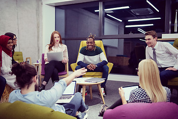 Image showing Multiethnic startup business team having meeting