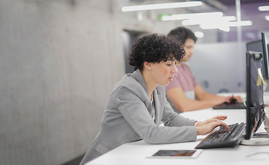Image showing female software developer using desktop computer