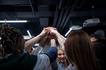 Image showing multiethnic Group of young business people celebrating success