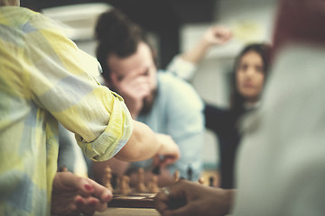 Image showing multiethnic group of business people playing chess