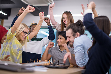 Image showing multiethnic group of business people playing chess