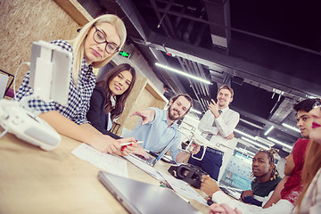 Image showing multiethnic business team learning about drone technology