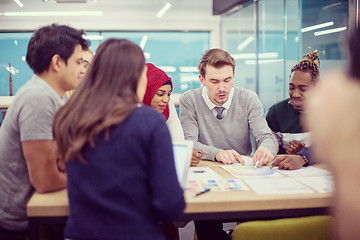 Image showing Multiethnic startup business team having meeting