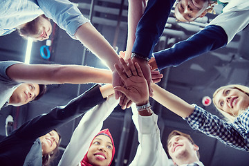 Image showing multiethnic Group of young business people celebrating success