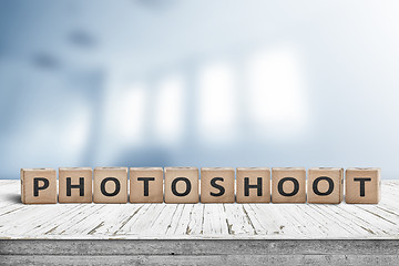 Image showing Photoshoot word sign on a wooden desk