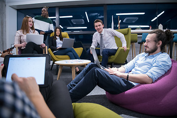 Image showing Multiethnic startup business team having meeting