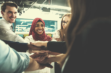 Image showing multiethnic Group of young business people celebrating success