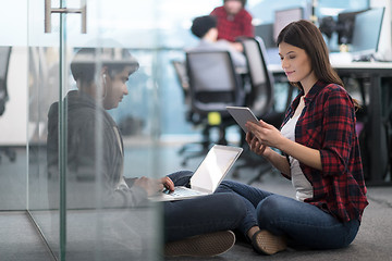 Image showing software developers couple working on the floor